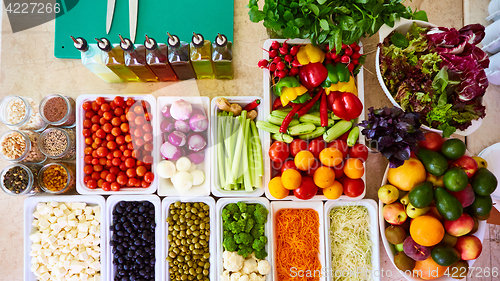 Image of Salad Bar Fresh Vegetables sliced Top view Tomato Carrot Celery Cucumber Cherry tomato Sweet pepper.