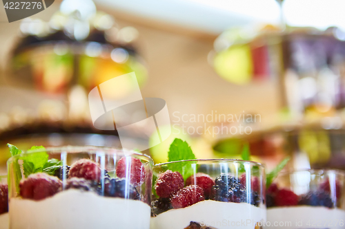 Image of Blackberry and raspberry in the white yogurt.