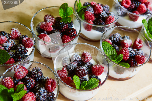 Image of Blackberry and raspberry in the white yogurt.