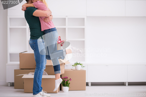 Image of happy Young couple moving in new house