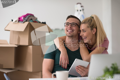 Image of Young couple moving in a new home