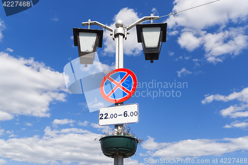 Image of Road sign stop is on lamp post