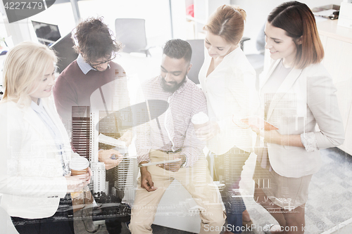 Image of business team with tablet pc and coffee at office