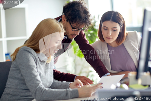 Image of business team with tablet pc at office