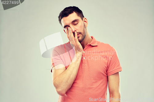 Image of young man suffering from headache