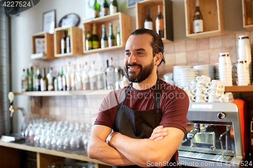 Image of happy man, barman or waiter at bar