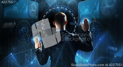 Image of businessman touching virtual screen