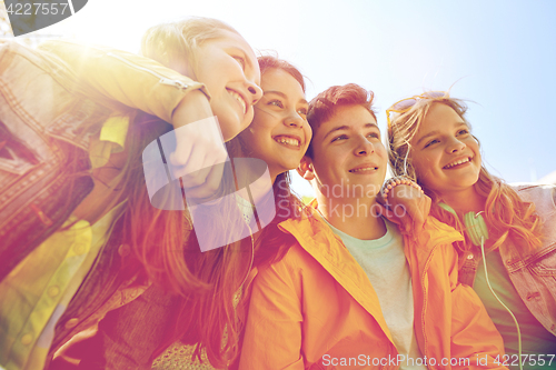 Image of happy teenage students or friends outdoors