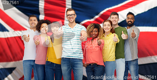 Image of people showing thumbs up over english flag