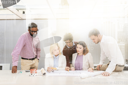 Image of business team discussing house project at office