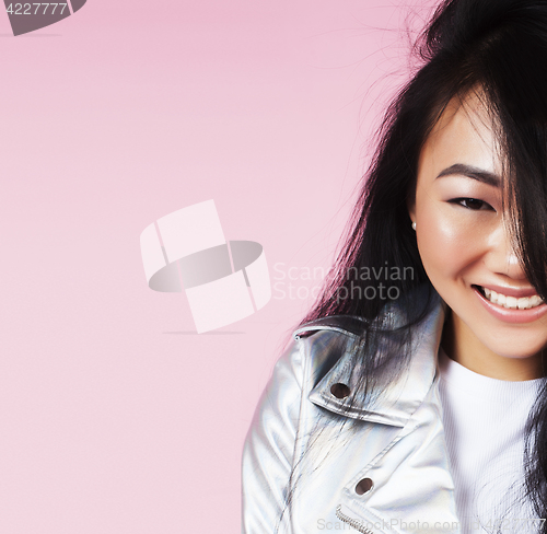 Image of young pretty smiling asian korean girl wearing modern fashion clothers on pink background, lifestyle people concept 