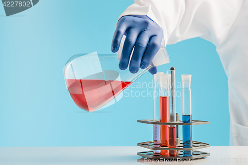 Image of Experiments in a chemistry lab. conducting an experiment in the laboratory.