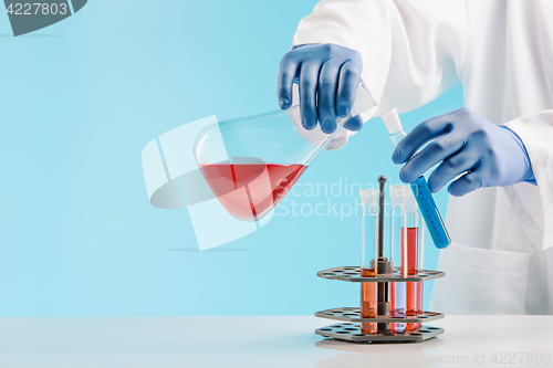 Image of Experiments in a chemistry lab. conducting an experiment in the laboratory.