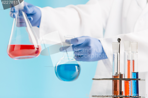 Image of Experiments in a chemistry lab. conducting an experiment in the laboratory.