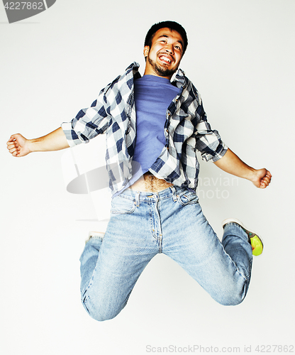 Image of young pretty asian man jumping cheerful against white background