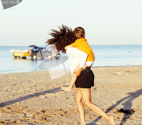 Image of pretty diverse nation and age friends on sea coast having fun, lifestyle people concept on beach vacations close up