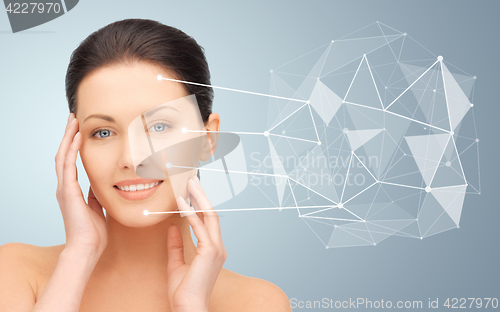 Image of woman face with low poly projection and pointers