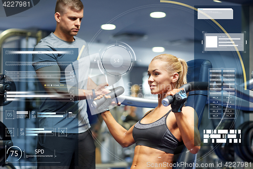 Image of man and woman flexing muscles on gym machine