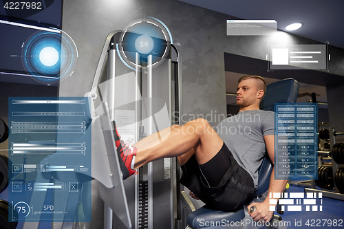 Image of man flexing leg muscles on gym machine