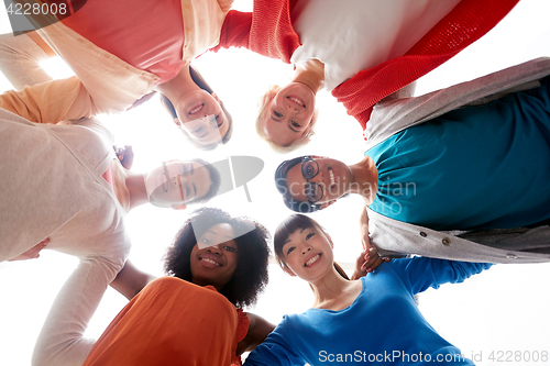 Image of international group of happy smiling women hugging