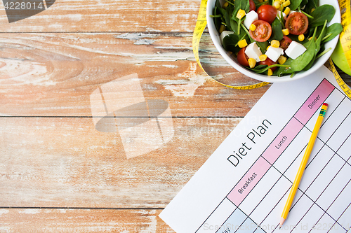 Image of close up of diet plan and food on table