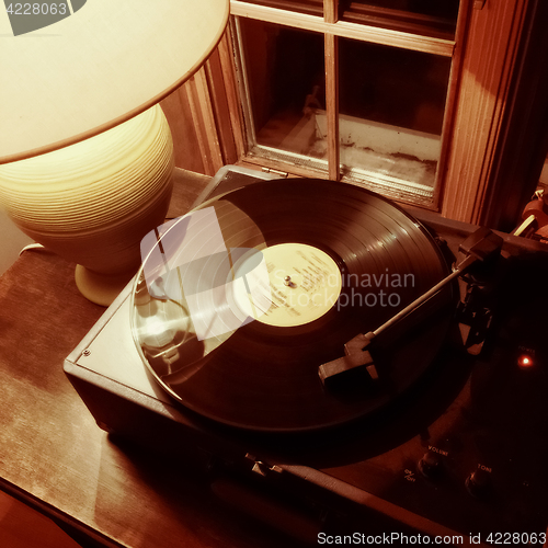 Image of Interior with vinyl record player and lamp