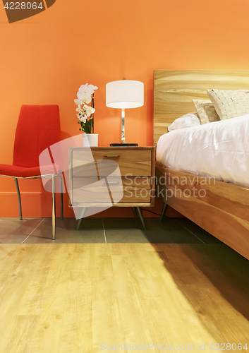 Image of Bright bedroom in orange tones