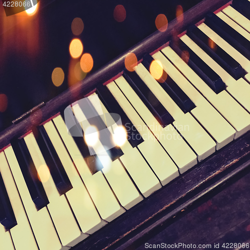 Image of Retro piano keys with bokeh lights