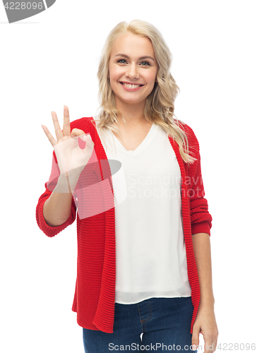 Image of happy smiling young woman showing ok hand sign