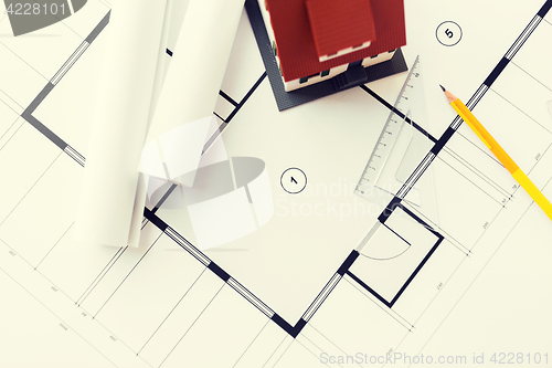 Image of close up of house model on architectural blueprint