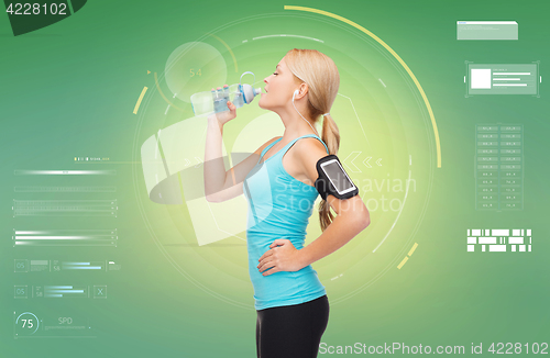 Image of woman training drinking water from bottle