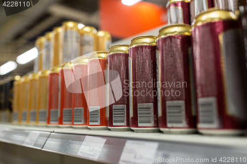 Image of close up of beer or cider cans at liquor store