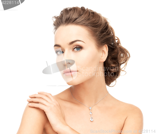 Image of woman wearing shiny diamond necklace