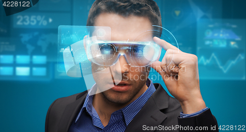 Image of businessman in virtual reality or 3d glasses