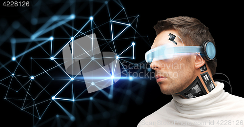 Image of man in virtual reality glasses and microchip