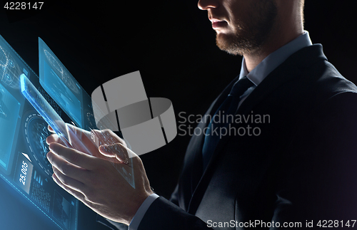 Image of close up of businessman with transparent tablet pc