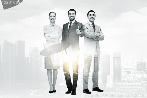 Image of group of smiling businessmen showing thumbs up