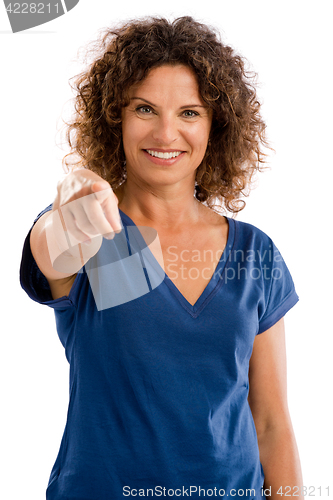 Image of Happy mature woman pointing