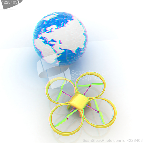 Image of Quadrocopter Drone with Earth Globe and remote controller on a w