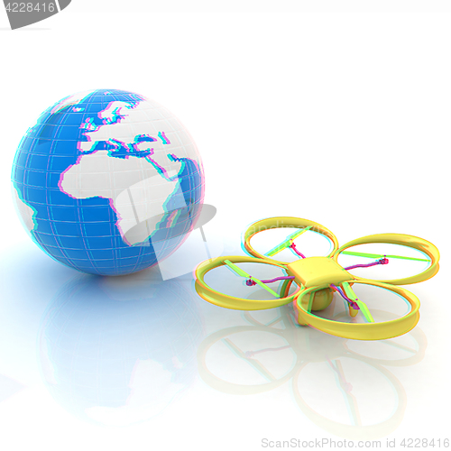 Image of Quadrocopter Drone with Earth Globe and remote controller on a w