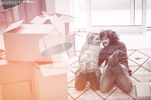 Image of Young couple moving in a new flat