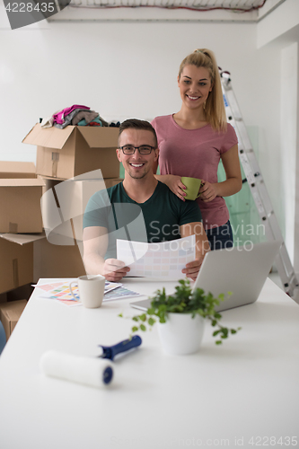 Image of Young couple moving in a new home