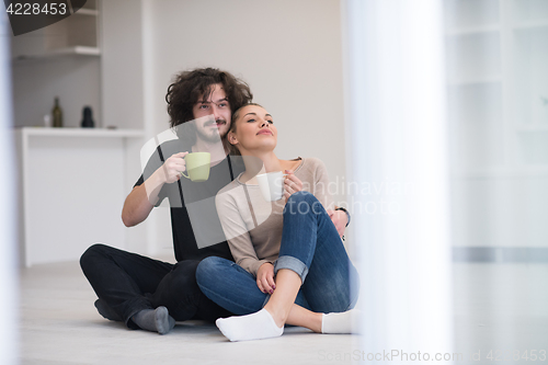 Image of young couple in their new home