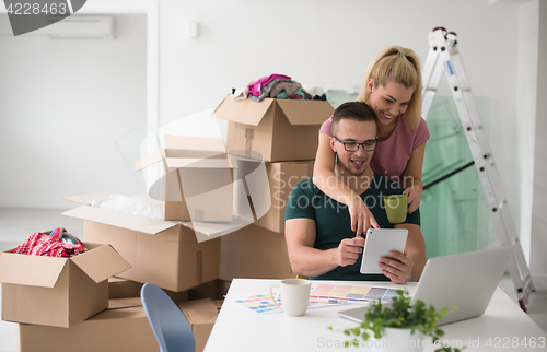 Image of Young couple moving in a new home