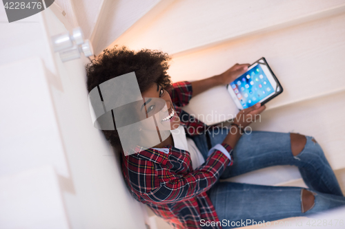 Image of black woman using her electronic tablet