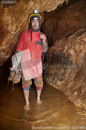 Image of Caving barefoot in water