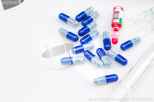 Image of Blue capsules and pills background