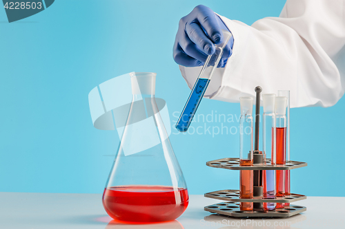 Image of Experiments in a chemistry lab. conducting an experiment in the laboratory.