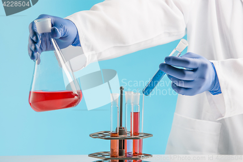 Image of Experiments in a chemistry lab. conducting an experiment in the laboratory.