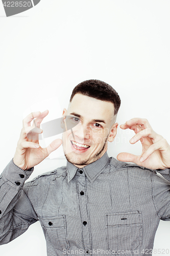 Image of young handsome well-groomed guy posing emotional on white background, lifestyle people concept